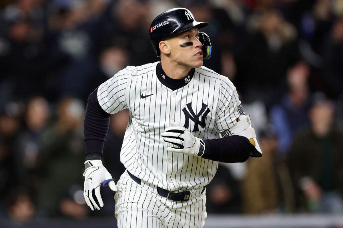 Aaron Judge #99 of the New York Yankees rounds the bases after hitting a two-run home run in the seventh inning against the Cleveland Guardians during Game Two of the American League Championship Series at Yankee Stadium