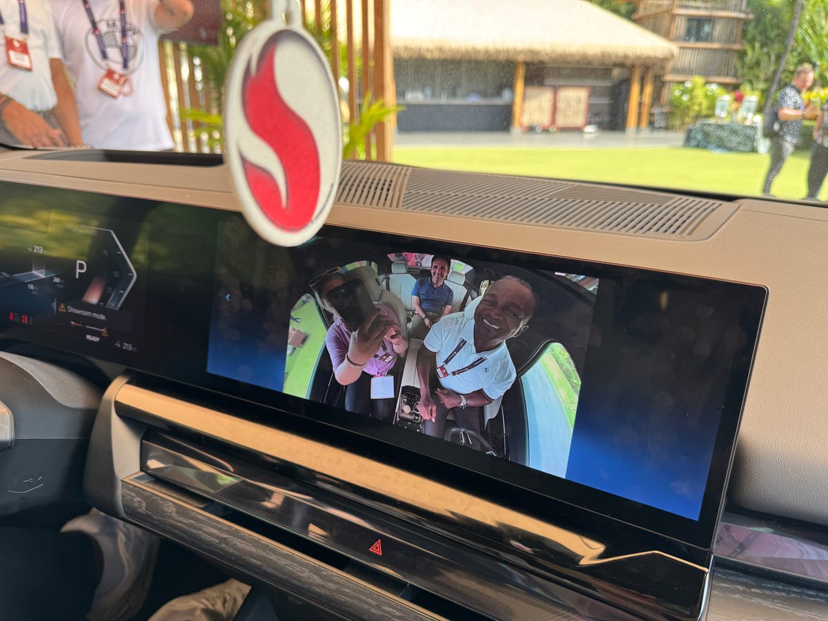 In-car selfie displayed on a large dashboard screen