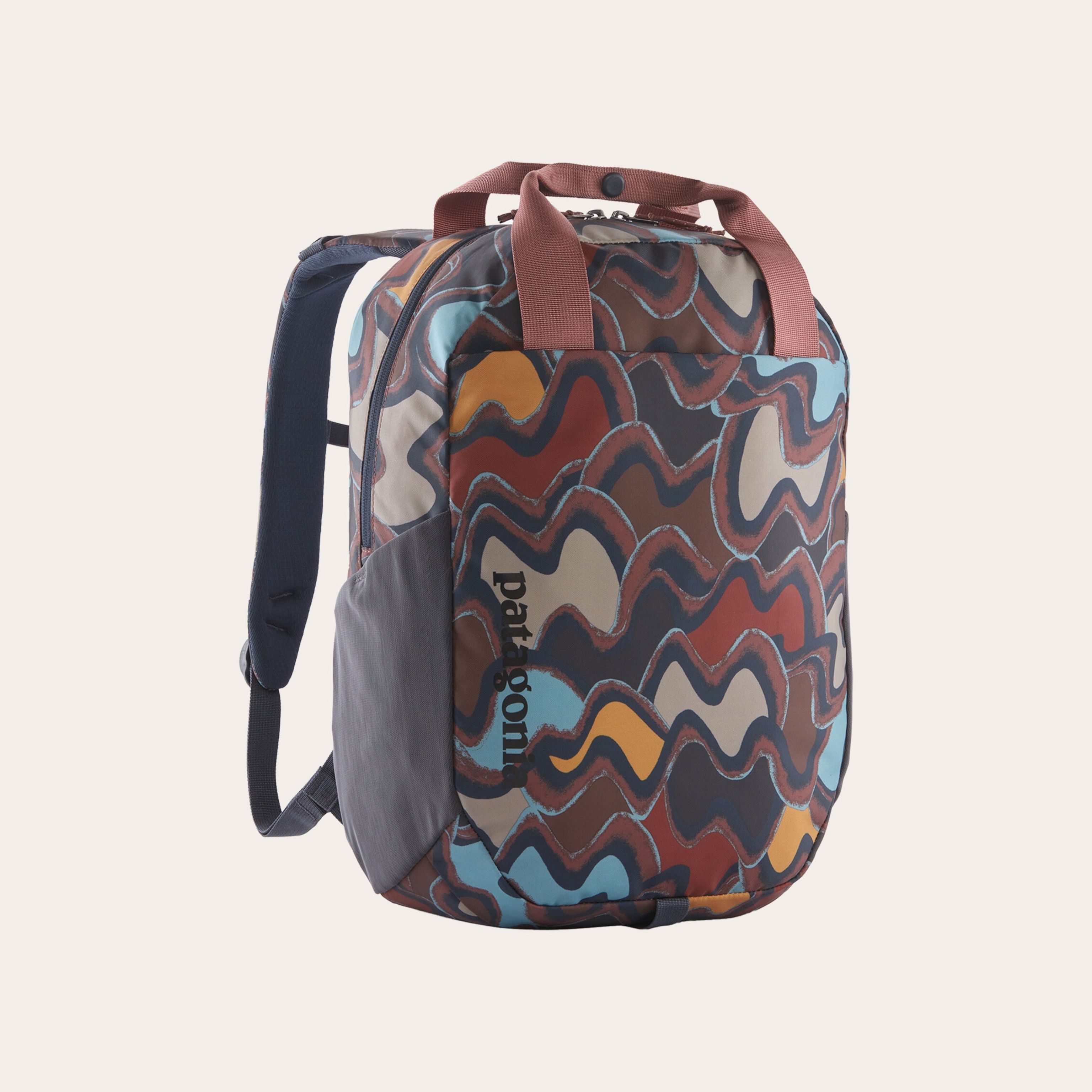 Different shades of rust patterned backpack placed on a tan background.