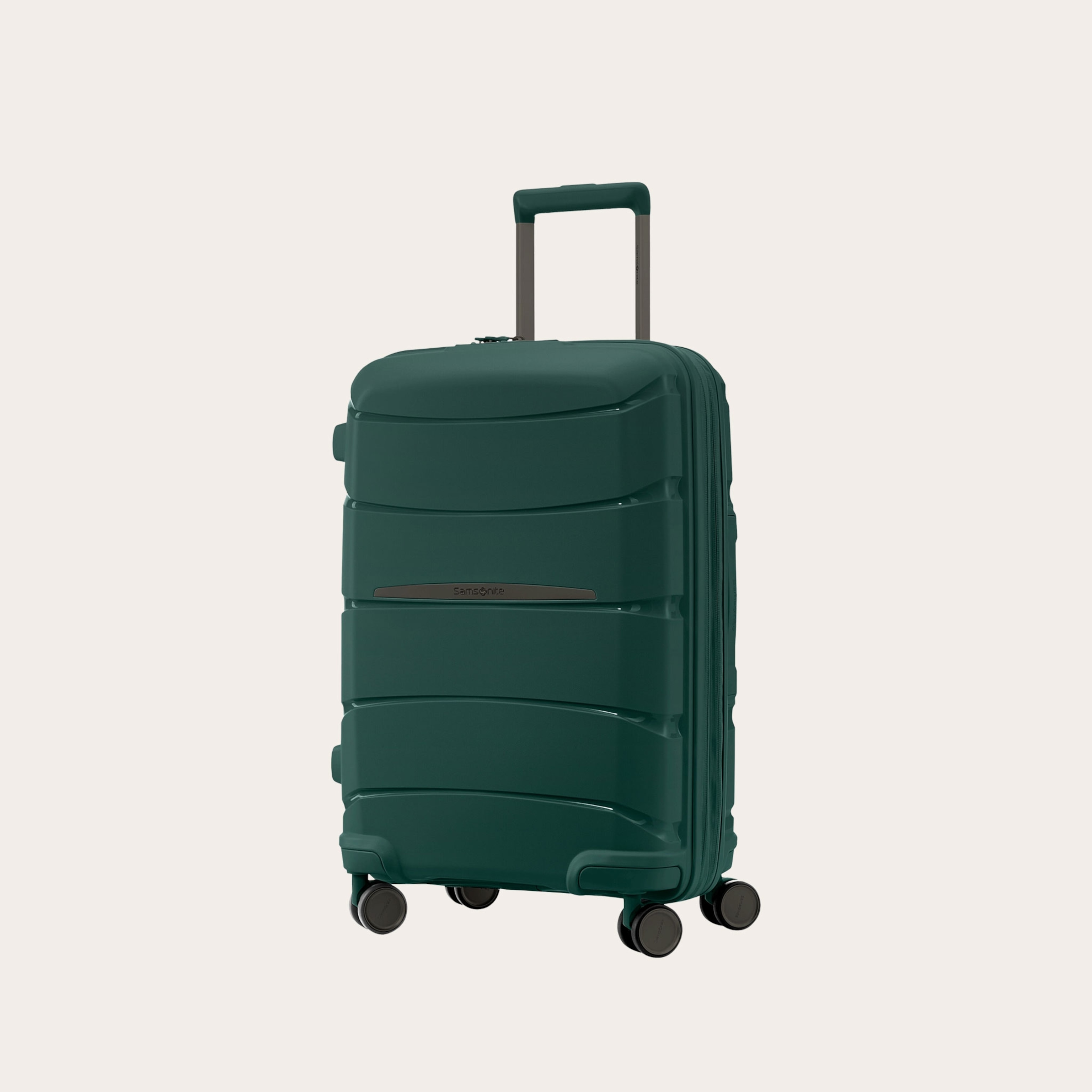 Dark green hard case suitcase placed on a tan background.