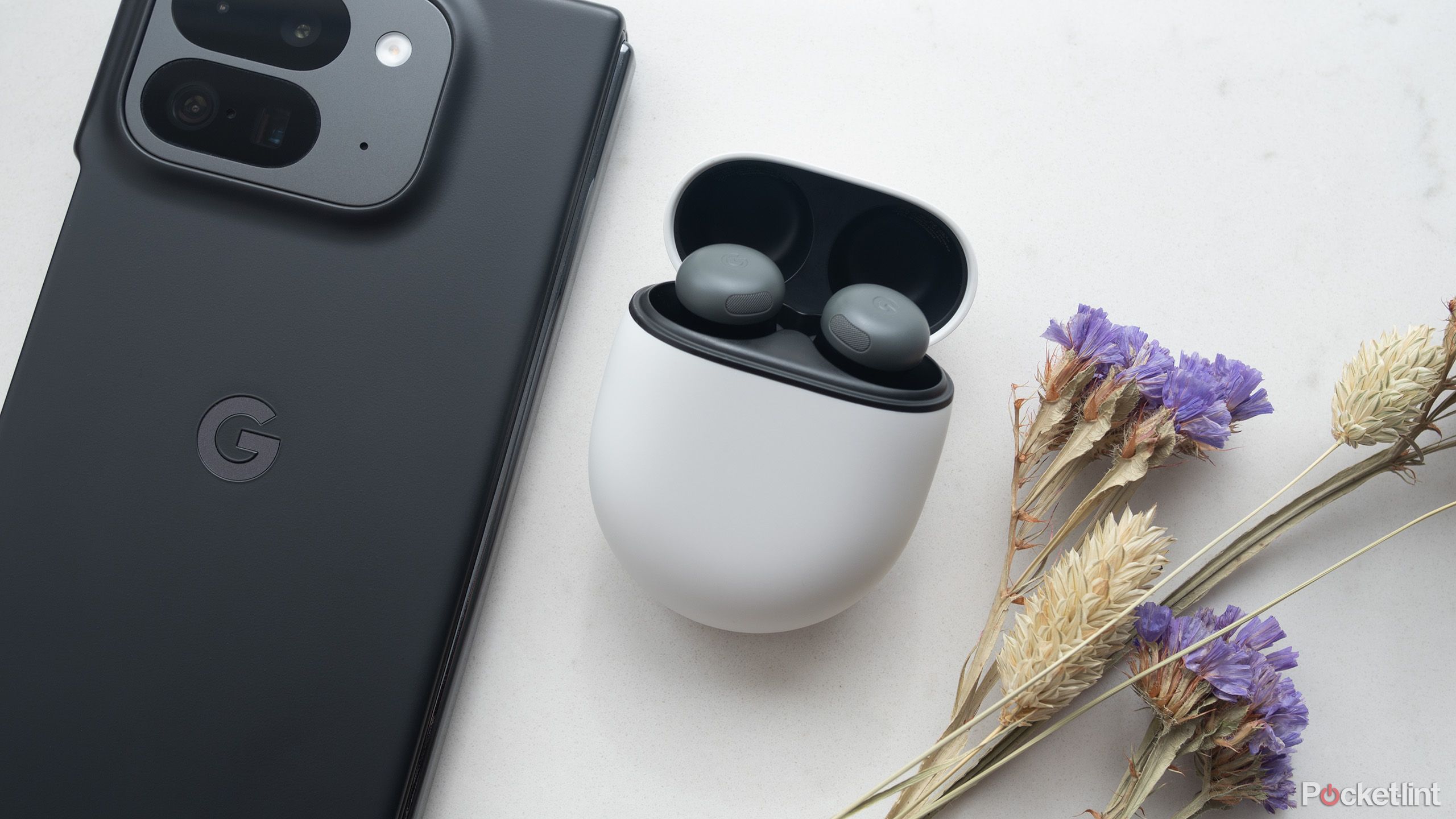 Google's Pixel Buds Pro 2 beside the Pixel 9 Pro Fold